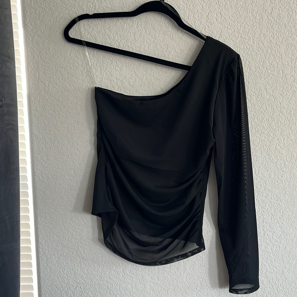 Black one shoulder mesh shirt.